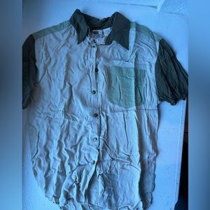 Men’s small green, and tan button up pocket on the front wrinkled from storage